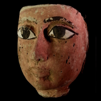An Egyptian Wood Mask of a Sarcophagus