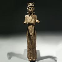 A Bone Votive Statuette of a Woman