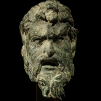 A Roman Bronze Head of a Satyr