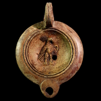 A Roman Pottery Oil Lamp Showing an Eagle