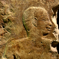 An Egyptian Limestone Relief Fragment of a Man