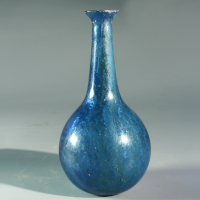 A Roman Blue Glass Unguentarium