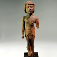 An Egyptian New Kingdom Wood Statuette of a Man