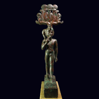 A Large Egyptian Bronze Statuette of Khonsu with Silver Inlaid Eyes
