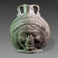 An Egyptian Flask Showing Two Female Heads