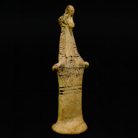A Terracotta Female Pappades Statuette