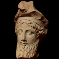 A Greek Terracotta Head of a Banqueter