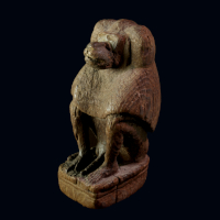 A Rare Egyptian Wood Statuette of a Baboon