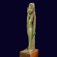 An Egyptian Green Glazed Faience Amulet of a Lion-Headed Goddess