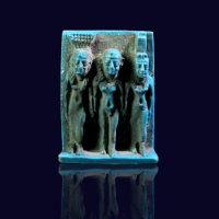 An Egyptian Bright Blue Glazed Amulet of a Divine Triade