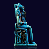 A Bright Turquoise-Blue Egyptian Faience Amulet of an Enthroned Lion-Headed Goddess