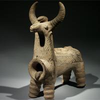 An Important and Rare Luristan Terracotta Bull with Snakes