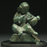A Roman Bronze Seated Figure of Harpokrates
